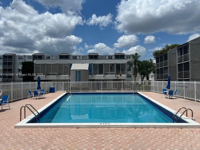 14165 SW 87th St Unit D202, Miami, FL 33183 - community pool with a patio