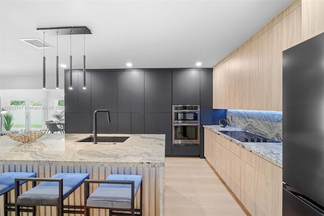 11530 NE 7th Ave, Biscayne Park, FL 33161 - kitchen with light brown cabinets, stainless steel appliances, modern cabinets, and recessed lighting