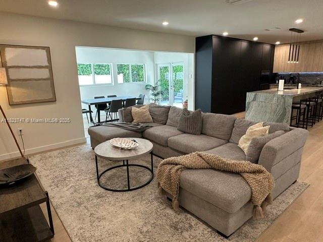 11530 NE 7th Ave, Biscayne Park, FL 33161 - living room with recessed lighting and light wood-style floors