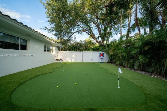 11530 NE 7th Ave, Biscayne Park, FL 33161 - fenced backyard featuring a putting area