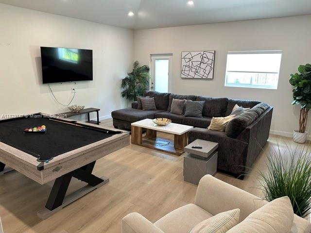 11530 NE 7th Ave, Biscayne Park, FL 33161 - living area with wood finished floors, recessed lighting, plenty of natural light, and billiards