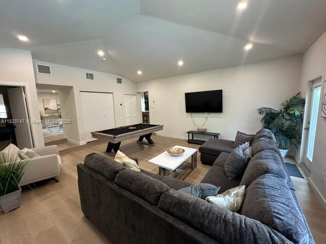 11530 NE 7th Ave, Biscayne Park, FL 33161 - living area with pool table, vaulted ceiling, light wood-style floors, and recessed lighting
