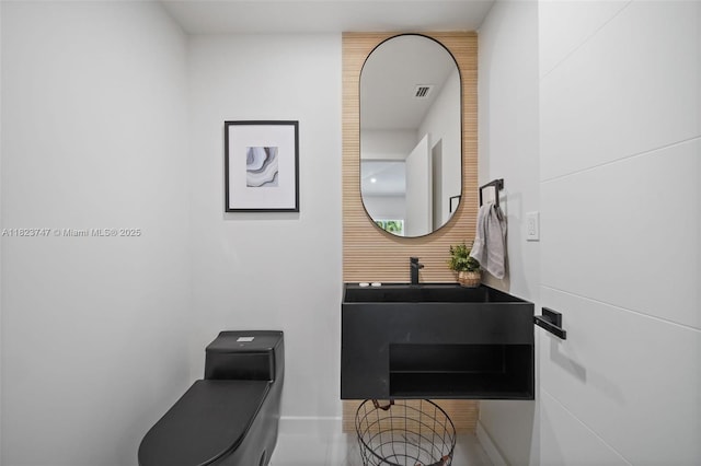11530 NE 7th Ave, Biscayne Park, FL 33161 - half bathroom with toilet and baseboards