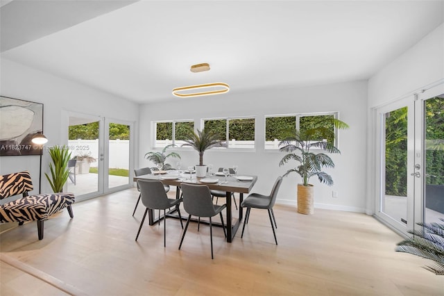 11530 NE 7th Ave, Biscayne Park, FL 33161 - dining space with french doors and light wood-style floors
