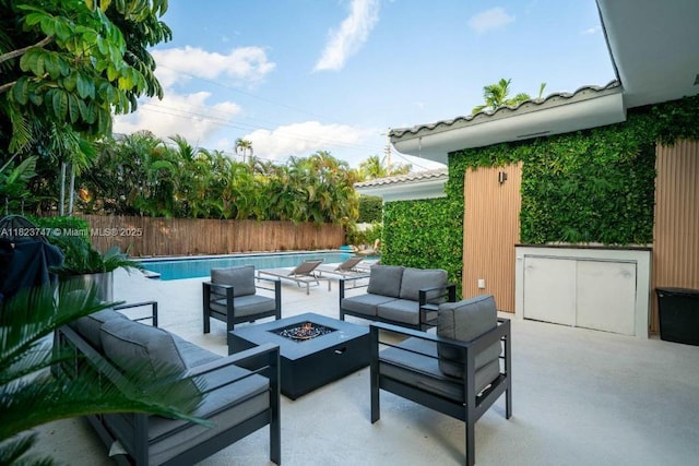 11530 NE 7th Ave, Biscayne Park, FL 33161 - view of patio with an outdoor living space with a fire pit