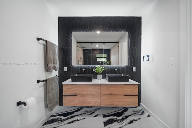 11530 NE 7th Ave, Biscayne Park, FL 33161 - bathroom with marble tiled floors, double vanity, and tasteful backsplash