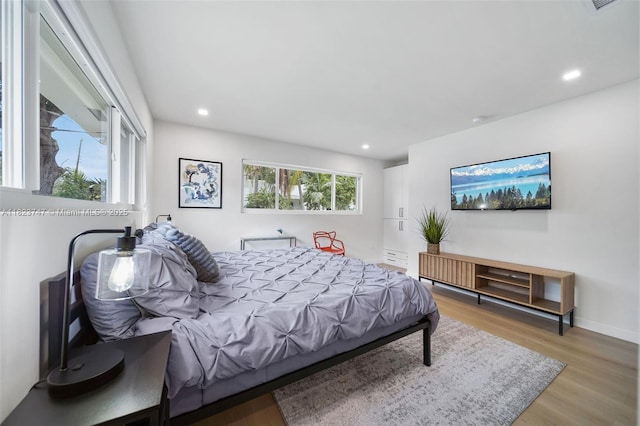 11530 NE 7th Ave, Biscayne Park, FL 33161 - bedroom featuring wood finished floors and recessed lighting