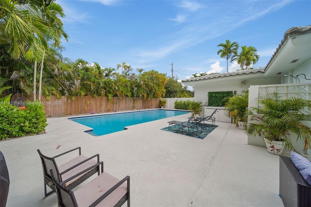 11530 NE 7th Ave, Biscayne Park, FL 33161 - view of swimming pool featuring a patio and a fenced backyard