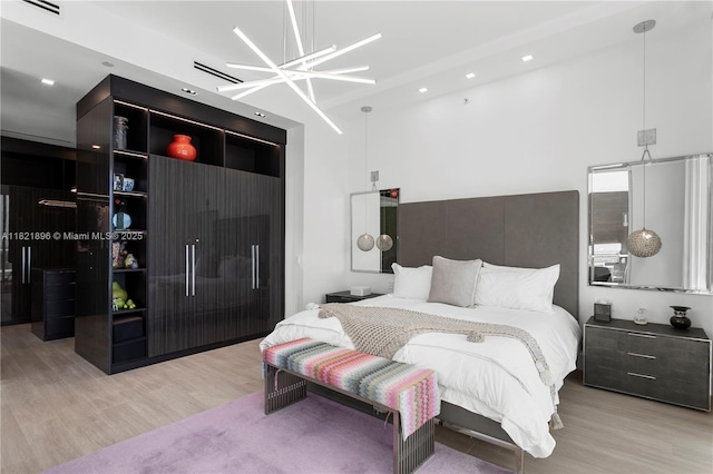 6000 Island Blvd Unit Ph7, Aventura, FL 33160 - bedroom with a towering ceiling, light wood finished floors, and recessed lighting