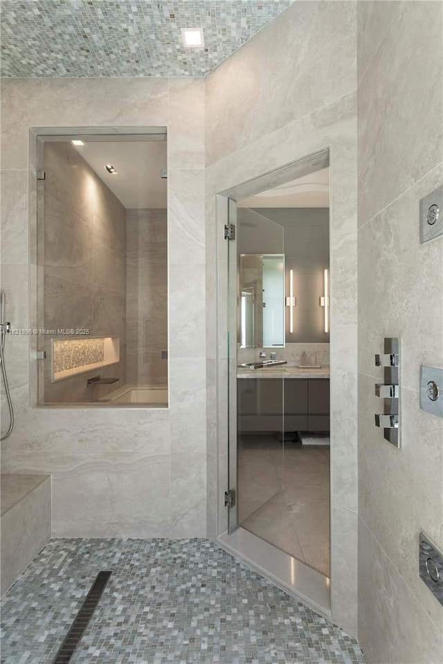 6000 Island Blvd Unit Ph7, Aventura, FL 33160 - bathroom with double vanity, tile walls, a shower, and tile patterned flooring