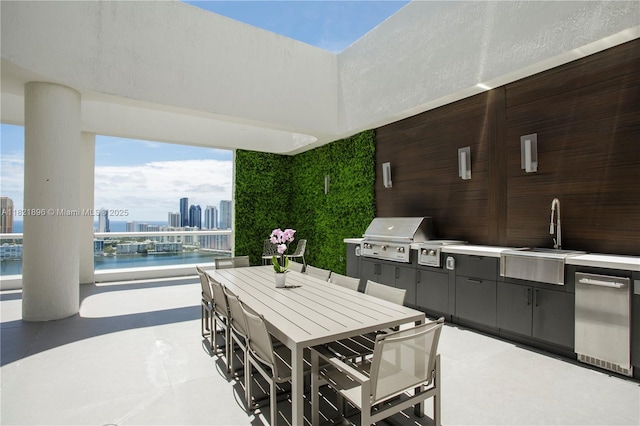6000 Island Blvd Unit Ph7, Aventura, FL 33160 - view of patio featuring area for grilling, outdoor dining space, a water view, and a skyline view