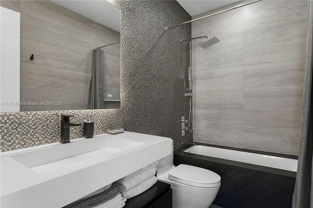 6000 Island Blvd Unit Ph7, Aventura, FL 33160 - full bathroom featuring tile walls, shower / bathtub combination with curtain, vanity, and decorative backsplash