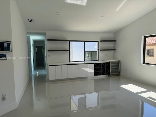 1205 Wallace St, Coral Gables, FL 33134 - kitchen with open shelves, white cabinets, wine cooler, modern cabinets, and recessed lighting
