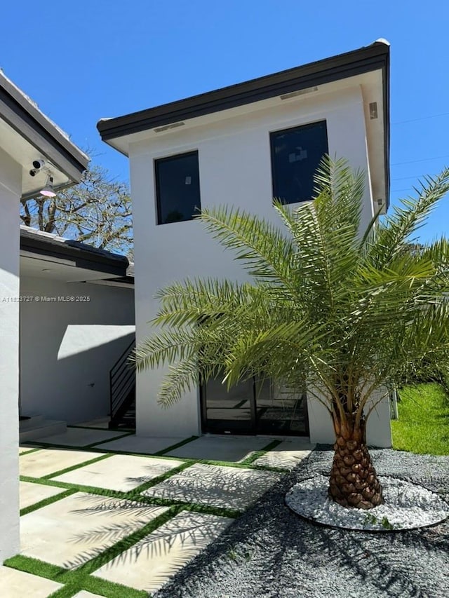 1205 Wallace St, Coral Gables, FL 33134 - view of side of home featuring stucco siding