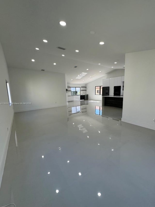 1205 Wallace St, Coral Gables, FL 33134 - unfurnished living room featuring vaulted ceiling and recessed lighting