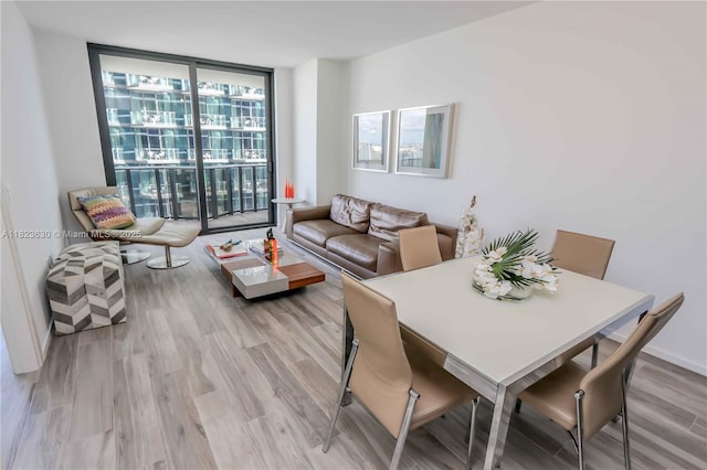801 S Miami Ave Unit 3108, Miami, FL 33130 - dining area featuring floor to ceiling windows and light wood-style flooring