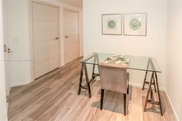 801 S Miami Ave Unit 3108, Miami, FL 33130 - dining room featuring wood finished floors and baseboards