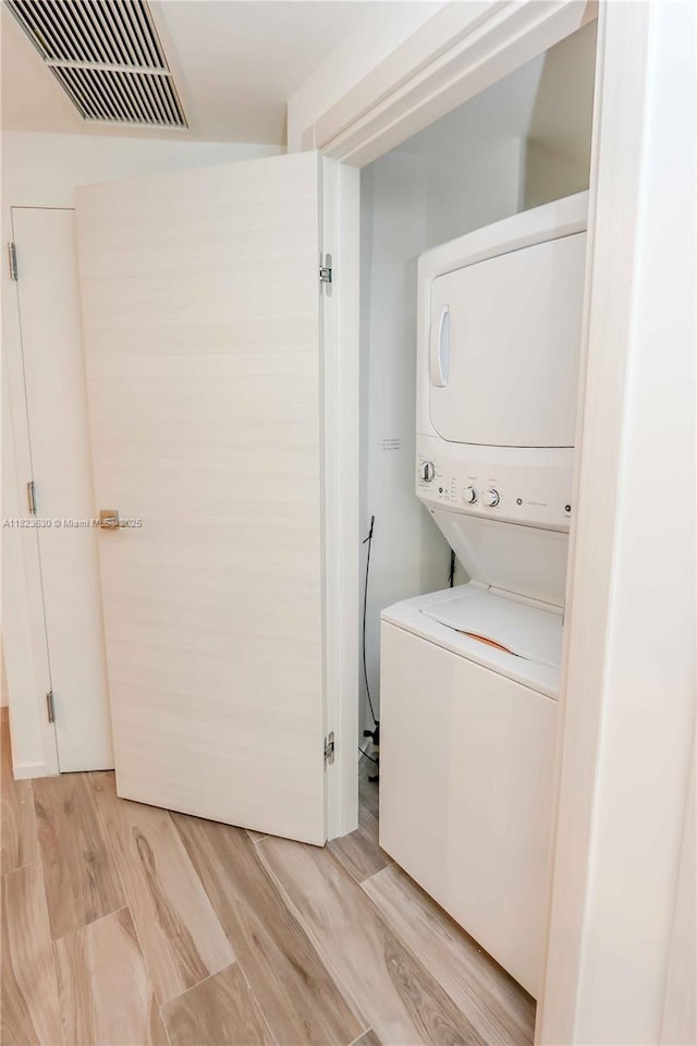 801 S Miami Ave Unit 3108, Miami, FL 33130 - laundry area with stacked washer / dryer and light wood-style flooring