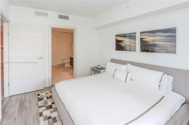 801 S Miami Ave Unit 3108, Miami, FL 33130 - bedroom with connected bathroom and light flooring