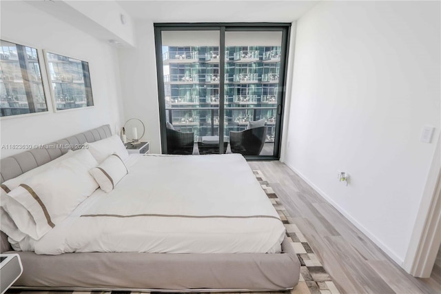 801 S Miami Ave Unit 3108, Miami, FL 33130 - bedroom featuring floor to ceiling windows and wood finished floors