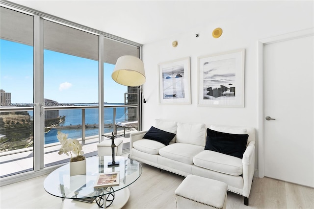 465 Brickell Ave Unit 2003, Miami, FL 33131 - living room with a water view, wood finished floors, and a wall of windows