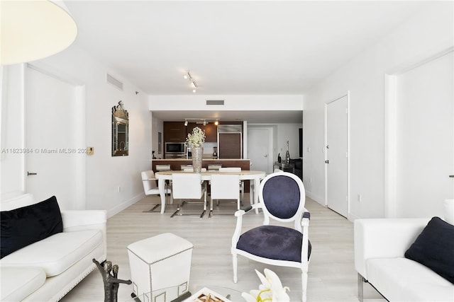 465 Brickell Ave Unit 2003, Miami, FL 33131 - living area featuring light wood-style floors and track lighting