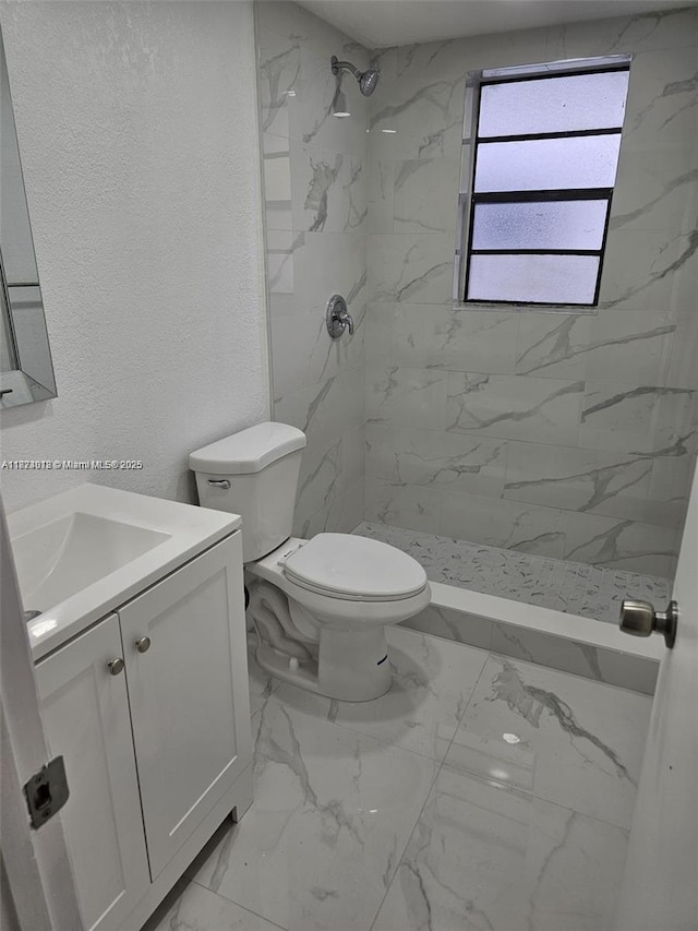 9440 Fontainebleau Blvd Unit 203, Miami, FL 33172 - bathroom with marble finish floors, vanity, a marble finish shower, and a textured wall