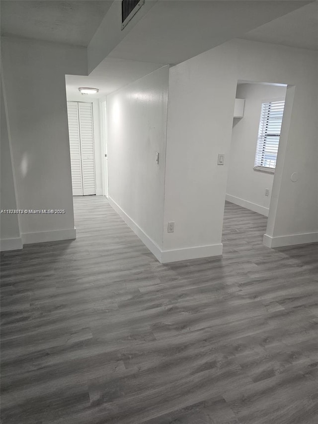 9440 Fontainebleau Blvd Unit 203, Miami, FL 33172 - unfurnished room featuring baseboards and dark wood-style flooring