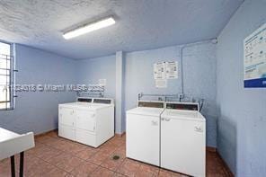 9440 Fontainebleau Blvd Unit 203, Miami, FL 33172 - shared laundry featuring washing machine and dryer and tile patterned floors
