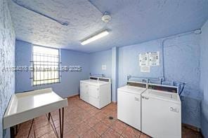 9440 Fontainebleau Blvd Unit 203, Miami, FL 33172 - laundry room featuring independent washer and dryer, tile patterned flooring, and a textured ceiling