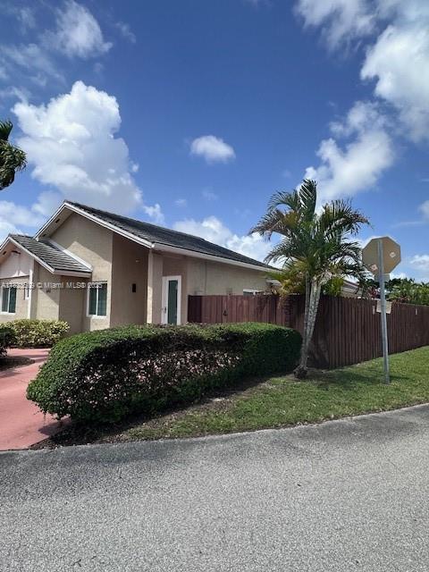 641 SW 99th Pl, Miami, FL 33174 - view of property exterior with stucco siding