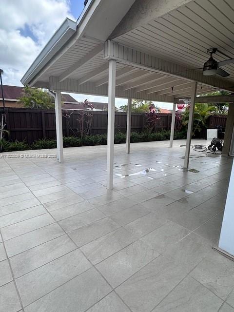641 SW 99th Pl, Miami, FL 33174 - fenced backyard with a ceiling fan and a patio area