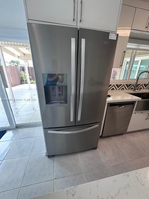 641 SW 99th Pl, Miami, FL 33174 - kitchen view of appliances with stainless steel finishes and light countertops