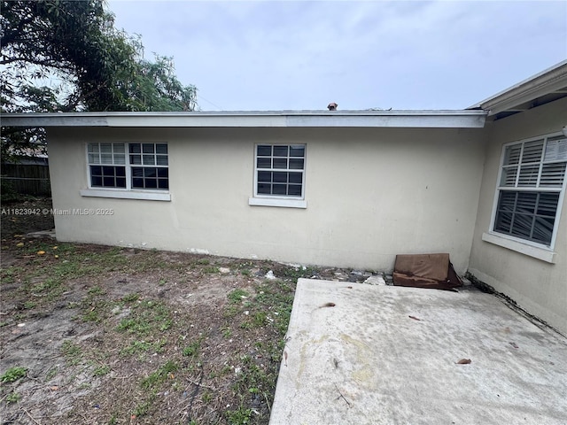 423 SW 10th Ave, Boynton Beach, FL 33435 - view of side of home with a patio area