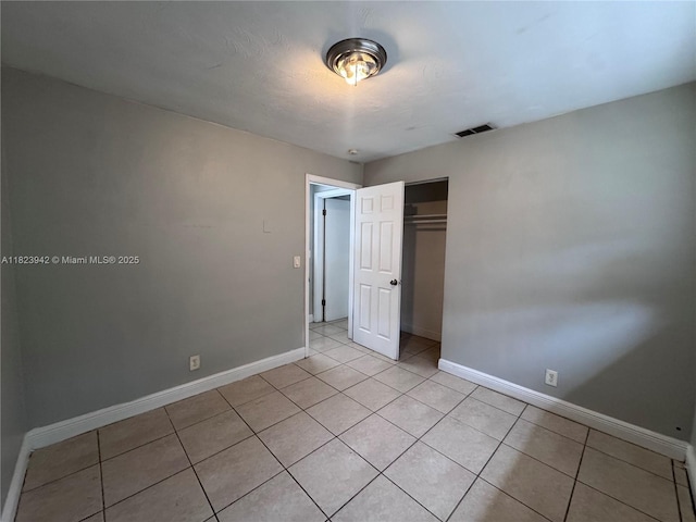 423 SW 10th Ave, Boynton Beach, FL 33435 - unfurnished bedroom with light tile patterned floors and a closet