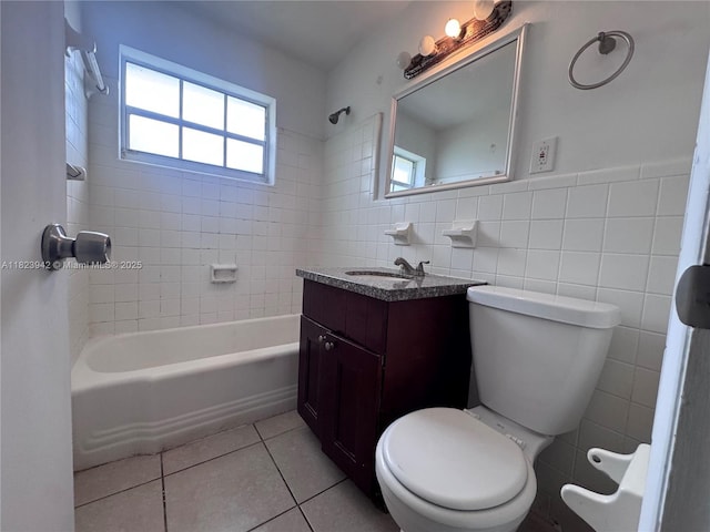 423 SW 10th Ave, Boynton Beach, FL 33435 - full bath with tile patterned floors, vanity, tile walls, tub / shower combination, and a wainscoted wall