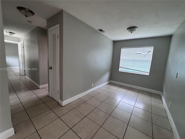 423 SW 10th Ave, Boynton Beach, FL 33435 - unfurnished room with light tile patterned floors and baseboards