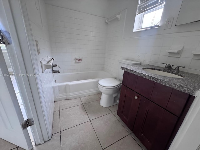 423 SW 10th Ave, Boynton Beach, FL 33435 - full bath featuring vanity, bathtub / shower combination, tile patterned flooring, and tile walls