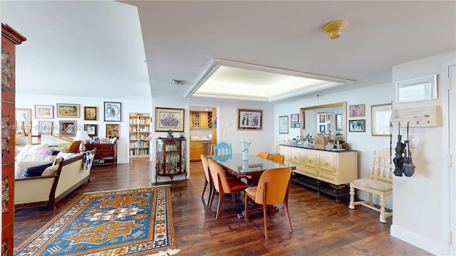 11113 Biscayne Blvd Unit 1055, Miami, FL 33181 - dining space featuring a raised ceiling and dark wood-type flooring