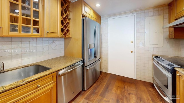 11113 Biscayne Blvd Unit 1055, Miami, FL 33181 - kitchen featuring stainless steel appliances, dark wood-type flooring, glass insert cabinets, tile walls, and brown cabinets
