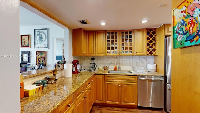 11113 Biscayne Blvd Unit 1055, Miami, FL 33181 - kitchen featuring stainless steel dishwasher, glass insert cabinets, tasteful backsplash, light stone countertops, and recessed lighting