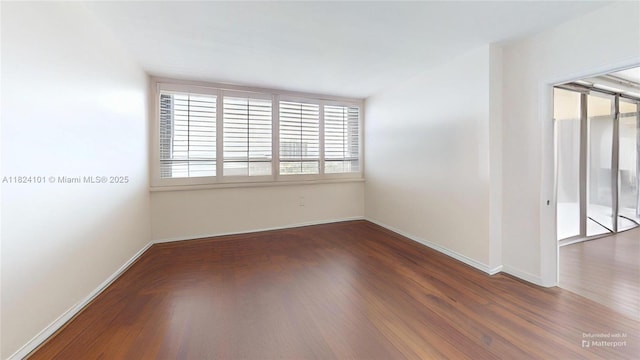 11113 Biscayne Blvd Unit 1055, Miami, FL 33181 - spare room featuring wood finished floors and baseboards