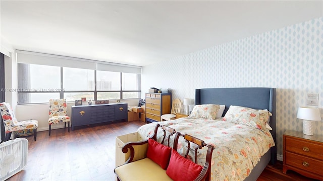 11113 Biscayne Blvd Unit 1055, Miami, FL 33181 - bedroom featuring wallpapered walls and wood finished floors