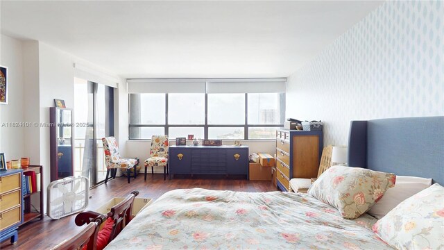 11113 Biscayne Blvd Unit 1055, Miami, FL 33181 - bedroom featuring wallpapered walls and wood finished floors