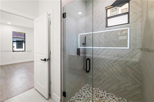 3305 18th St W, Lehigh Acres, FL 33971 - bathroom featuring a shower stall and wood finished floors