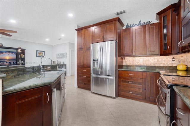 801 NW 156th Ave, Pembroke Pines, FL 33028 - kitchen featuring appliances with stainless steel finishes, backsplash, dark stone counters, glass insert cabinets, and a ceiling fan