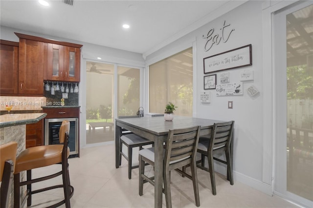 801 NW 156th Ave, Pembroke Pines, FL 33028 - dining area with beverage cooler, a bar, plenty of natural light, recessed lighting, and light tile patterned flooring