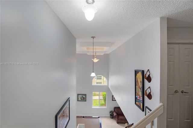 801 NW 156th Ave, Pembroke Pines, FL 33028 - staircase with a textured ceiling, a towering ceiling, and tile patterned flooring
