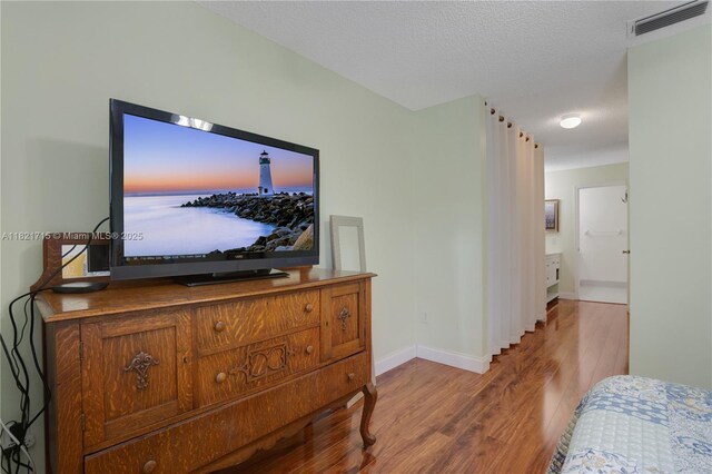 801 NW 156th Ave, Pembroke Pines, FL 33028 - bathroom featuring vanity, wood finished floors, and a textured ceiling
