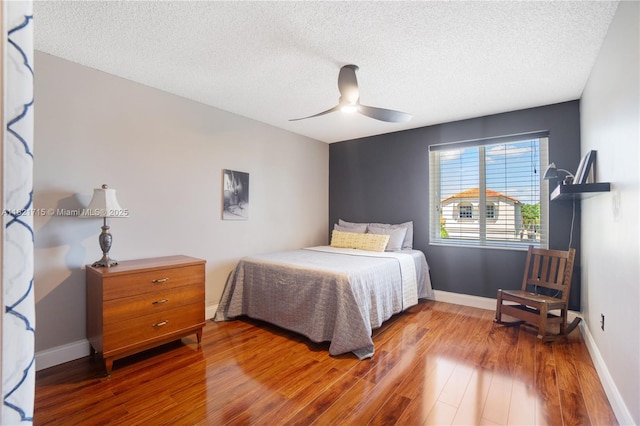 801 NW 156th Ave, Pembroke Pines, FL 33028 - bedroom featuring wood finished floors, a textured ceiling, and a ceiling fan